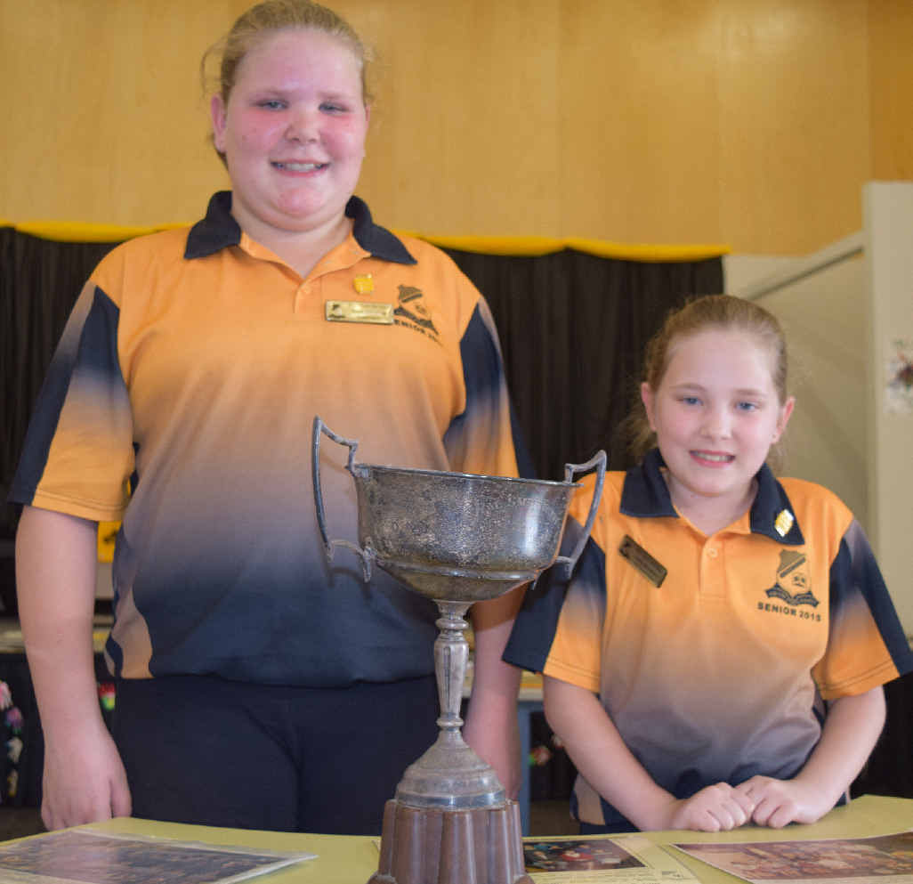 Glennie Heights State School student leader Sarah Grimshaw and vice-captain Emily De Luien look over some school history. Glennie Heights State School student leader Sarah Grimshaw and vice-captain Emily De Luien look over some school history.